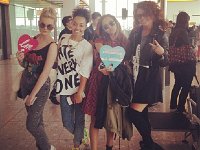 Little Mix  Perrie Edwards wearing optical white high top chucks.